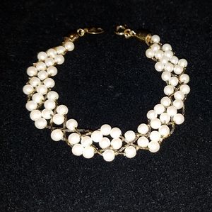 TRIFARI - gold-tone, multi-strand pearl bracelet